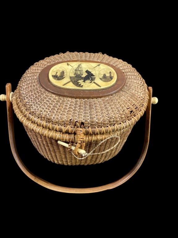 Nantucket Friendship Basket: Early basket in Larger size, 10 x 7.5 x 8 inches, with plain bent wood handle, bone pin and pegs at handle, oval bone scrimshall plaque with three oval scenes, Sailing vessel with whale tail, light ho
