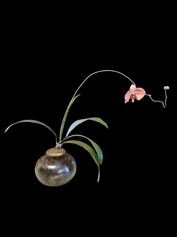 Joey Bonhage Metal Orchid Sculpture: New Orleans, 1941-2008.. enameled metal sculpture in a glass vase with faux sphagnum moss potting media, surface dust and light media loss..21H x 26W inches
