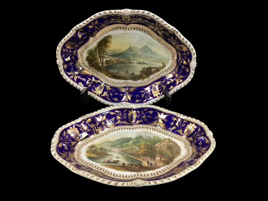 Pair of Bloor Derby Nanette Shaped Dishes: 11 inch dishes feature scenic views ..View of Lions and The Bay of Naples. GI,T harebell leaves, deep banded cobalt borders, foliate scrolls, gadrooned rim, circle stamped in red.