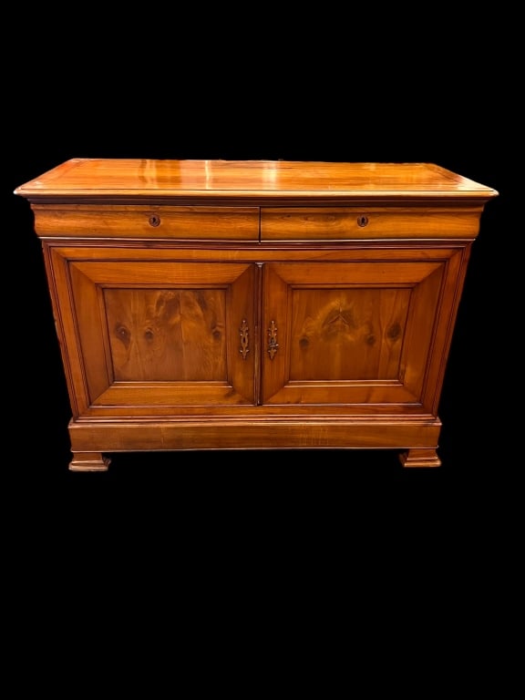 19th century French buffet: Chery , two dovetailed shaped drawers, bracket feet, panel door, 40 inches tall by 55 wide by 23 deep