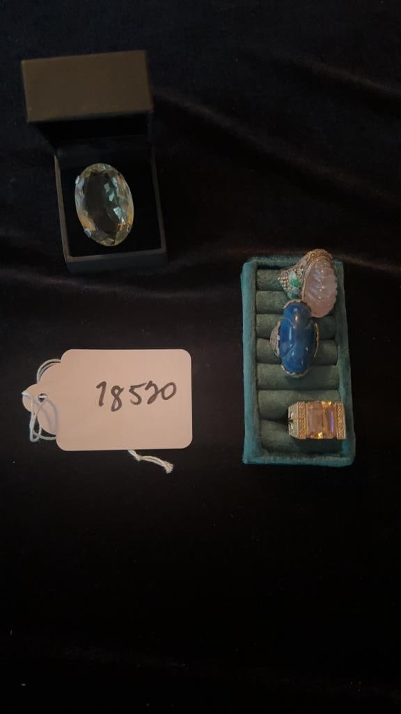 Dramatic large rings: 4 rings 925 on 2 of them (that are visible) Large lemon quartz Rose quartz ribbed cut set in ornate 1950s spring setting Kunzite ring in gold setting L?piz lazuli in 1920s art deco