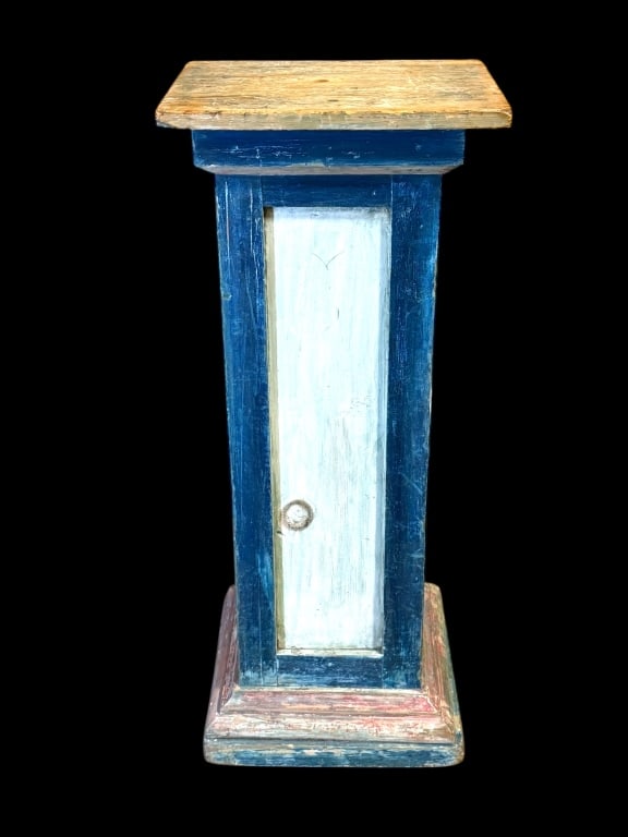 White Pine Pedestal in Original Paint: Late 19th C, original blue, white and red paint, paneled with molded base, 38.5 tall x 15 wide x 15 deep. Back of top is flush with column,