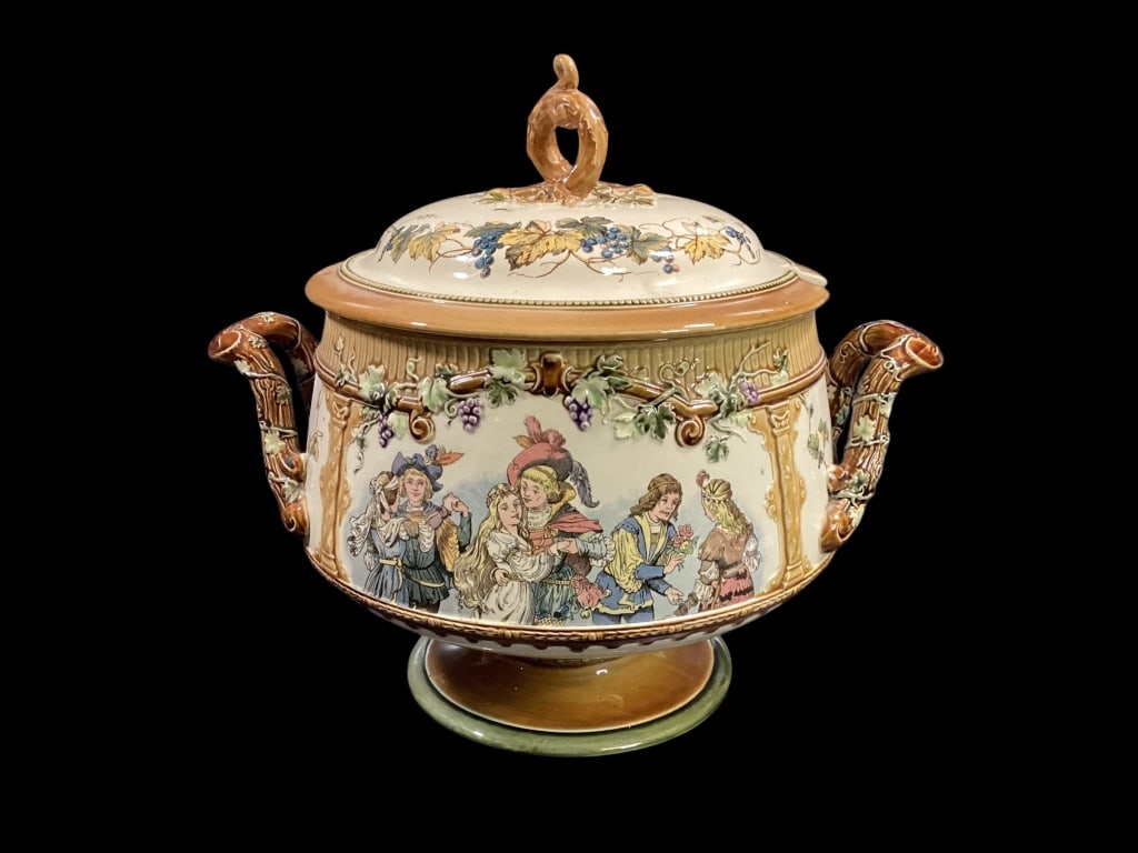 Villeroy and Boch Mettlach Punchbowl: Lovely large Punch bowl with relief designs of grape vines, twig handles, scenic panels featuring musicians and dancing couples, footed base, with fitted lid and matching16 inch under tray * no ladle