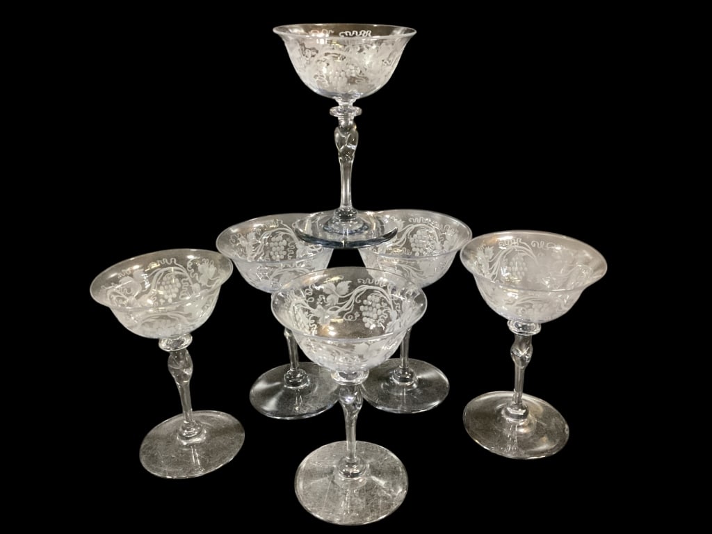 Set of Six Steuben Champagne Stems: Etched grape and vine designs, 4 are etched marked at base