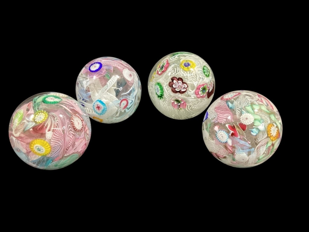 Four Murano Art Glass Paperweights: Latticino Millefiori style with colorful cut canes, white lace spirals, pink ribbons all about 3 inches