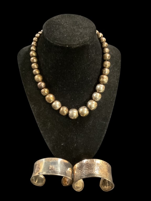 Mexican Sterling Neclace, Bracelets: 14 inch graduated size sterling bead necklace, marked Mexican, 2 open cuff bracelets at 1.5 inches, hammered piece not marked, other stamped as 925