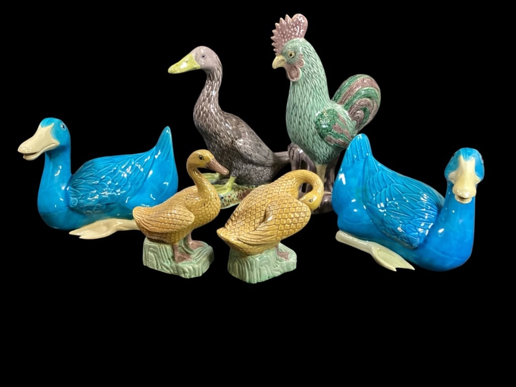 Chinese Porcelain Glazed Animals: Pair of resting ducks, 8 inches in teal glaze, 10 inch tall Rooster, mulberry and green feathers, 9 inch duck in mulberry, both stamped China, pair 6 inch ducks in golden yellow glaze