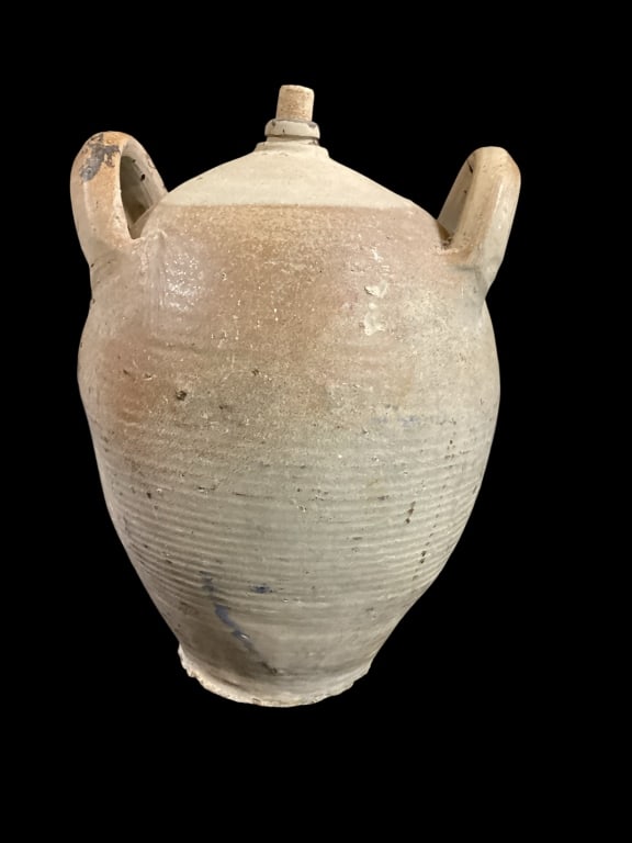 French Stoneware Jug: Sturdy French stoneware jug, typical form with double handles. Small spout.Used in rural French kitchens for cider or other liquids. Earth tone clay with some color decoration. 16 inches tall.