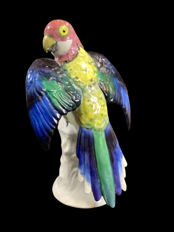 Karl Ens Porcelain Parrot: Ens manufactured in Volkstedt Germany, 11.5 inch perched parrot, colorful body, seated on a white glazed tree stump?hand decorated and signed to base, underglaze blue mark KVE