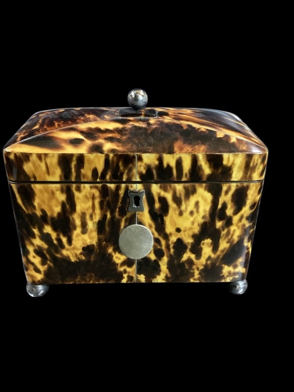 George III Tortiseshell Tea Caddy: Early tea caddy, domed style lid, 7 x 6.5 inches, sits on ball feet, with matched finial, interior two compartments with lids, bone finial tops, old lining. Good color and condition