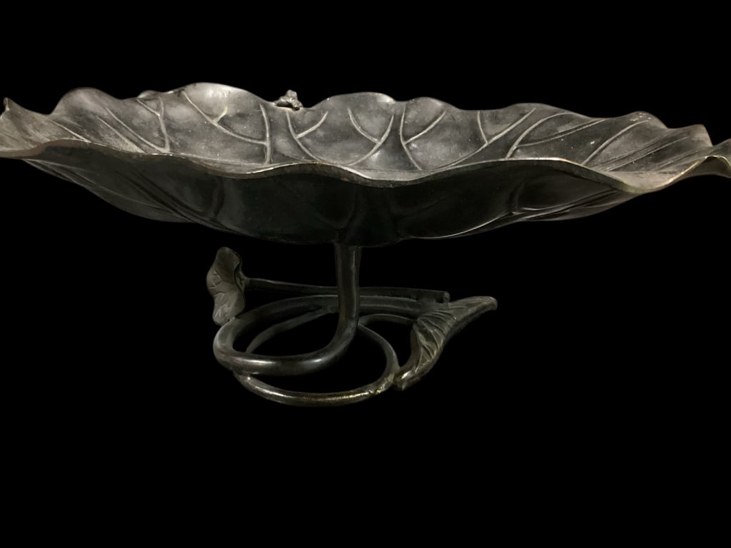 Japanese Bronze Okimono, Meiji Period: Dark patinated bronze Lotus bowl, 12 x 9 inches, with broad leaf design bowl, small frog peeps over rim, the footed base with trailing flower stem. Signed to reverse