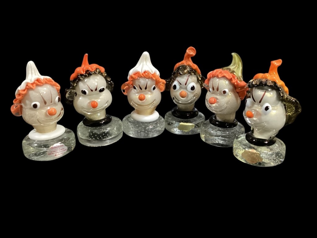 Murano Art Glass Paperweights: Designed by Alfredo Barbini, whimsical clown head paperweights, 5.5 inches tall, with encased bubbles in base, applied facial features, caps in varied color?Mid 50s, some with old paper labels