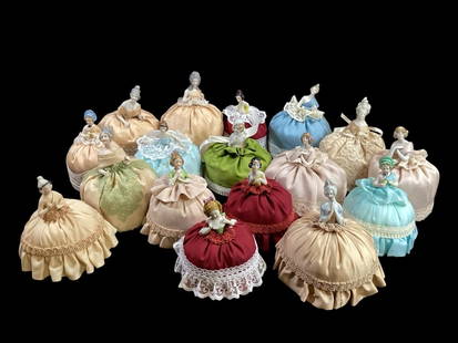 Collection of Porcelain Pin Cushion Dolls: 17 pieces, Half body boudoir dolls with stuffed lower bodies. Pin cushions originally they later became dresser articles. Each with varied female forms, some Victorian, Art Deco, and Elizabethan styli