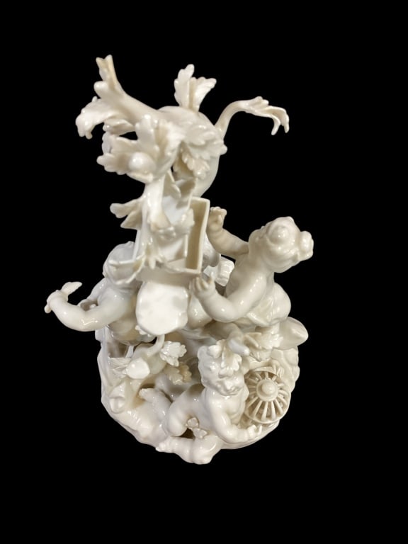 Whimsical Porcelain Figure, Cherubs: Nymphenburg Porcelain Figural Grouping, depicting Cherubs catching varied birds including an owl .9 inches tall in glazed blanc de chein.
