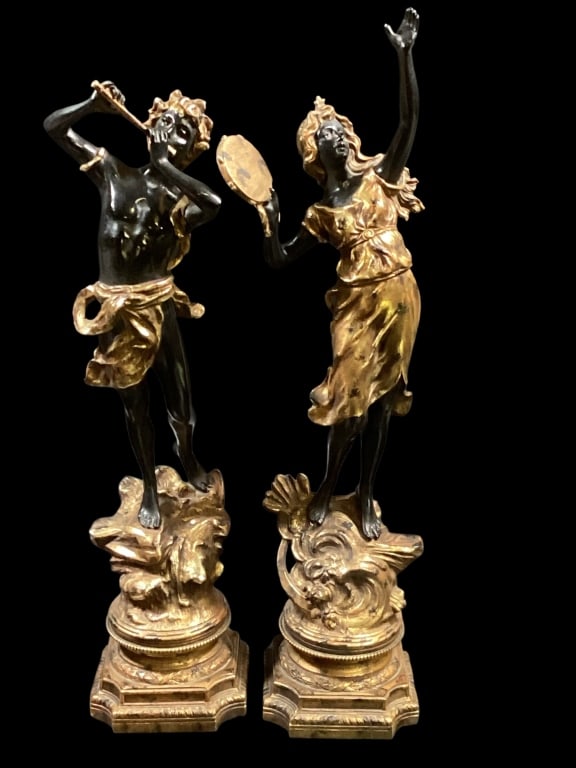 Pair French Spelter Figures: Later 19th century Patinated and Gilt decorated 22 inch tall musical figures. Peasant style girl and boy playing a flute and tambourine