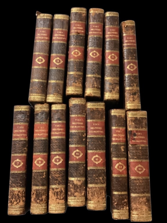 Thirteen Volumes French History of The Martyrs: Written by Louis Pierre Anquetil, published in 1811. specifically focusing on lives of Christian Myrtis and early Church leaders. Printed in Versailles. Full leather bound, with gilt stamped spines sp