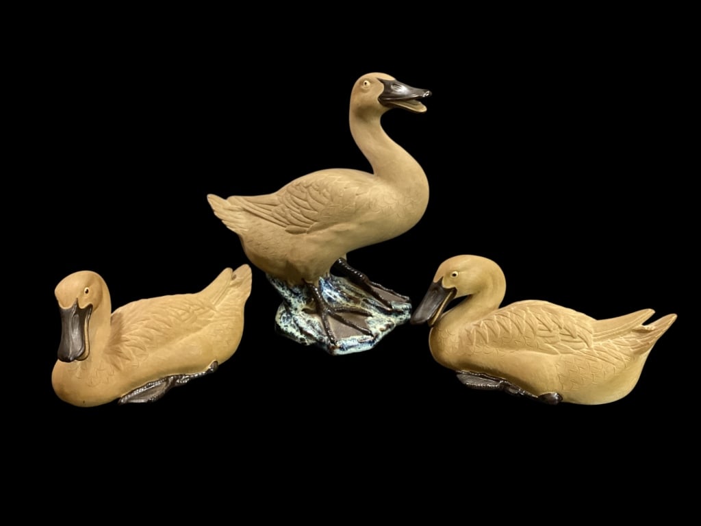 Chinese Shiwan Duck Family: Vintage Shiwan Chinese Duck figures. The larger stands at 10 inches, two resting at 8 inches. Hand painted with detailed feather worked clay