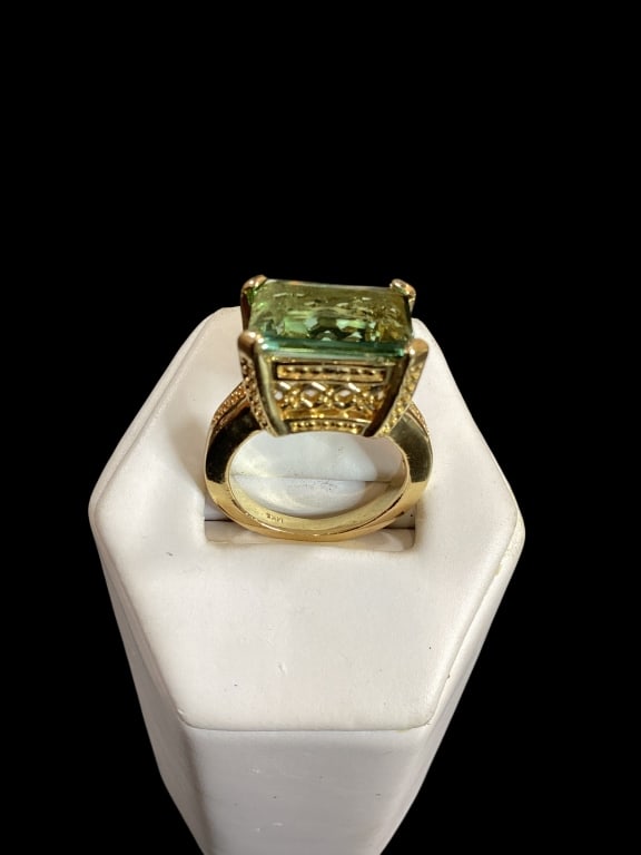 14 K Yellow Gold and Green Amethyst Ring: Cushion cut stone set in a wide reticulated gold mount. Size 6