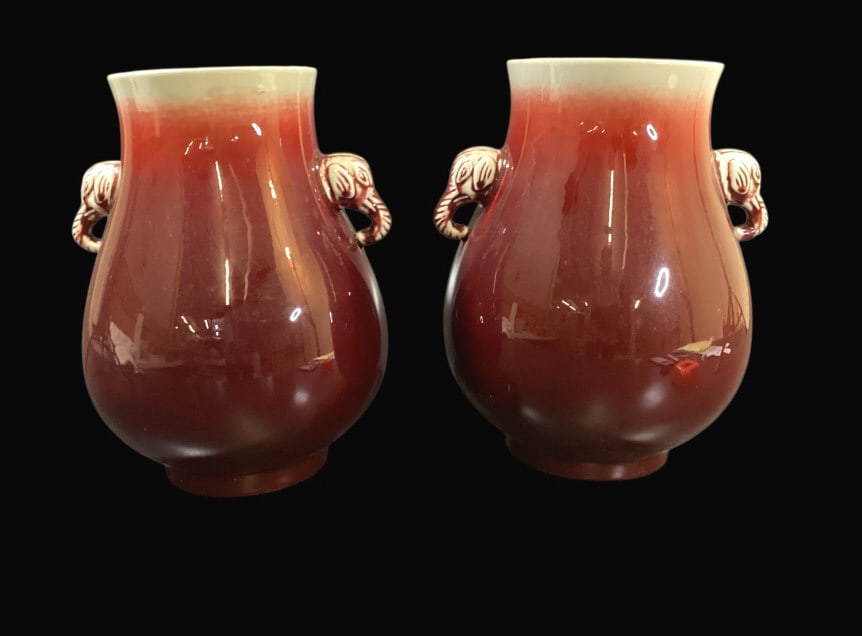 Pair Chinese Porcelain Vases: Oxblood vases with elephant head handles, 13 inches tall with bulbous body. Blue chop seal marks