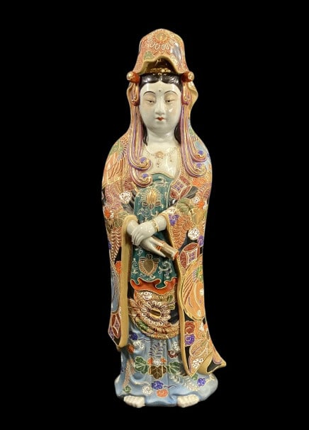 Japanese Porcelain Statue, Guanyin: Satsuma Moriage Raised enamel decorated figure, also known as Kannon, Goddess of Mercy. 24 inches tall, in a standing pose with serene expression and flowing robe. Good vibrant colors, she holds a scr