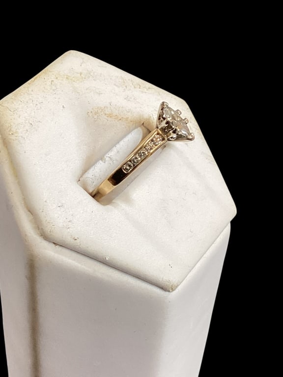 14 K Yellow Gold and Diamond Ring: Marquis cut center stone, flanked by 5 diamond chips each side. Size 6.5