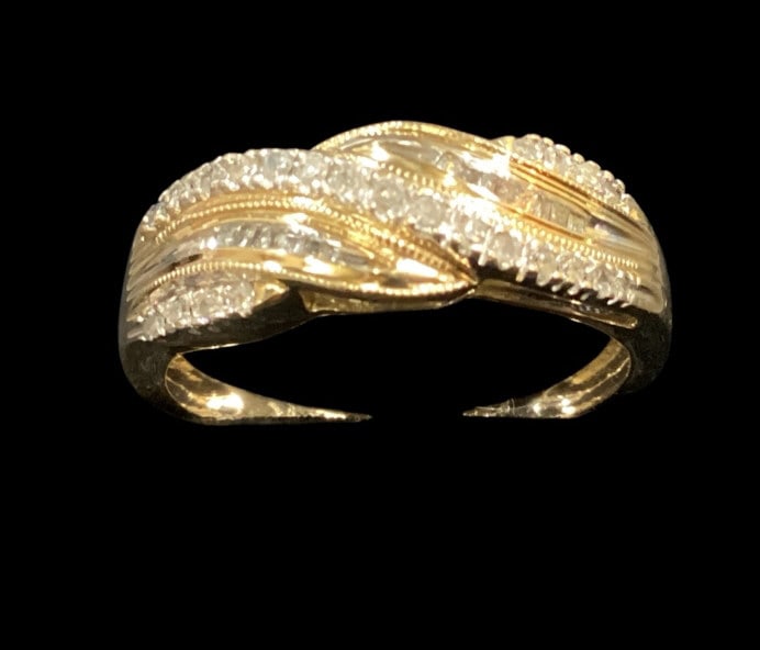 14 K Yellow Gold and Diamond wedding Band: Twist style gold textured band with 5 rows round and baguette cut diamonds. Size 7.5