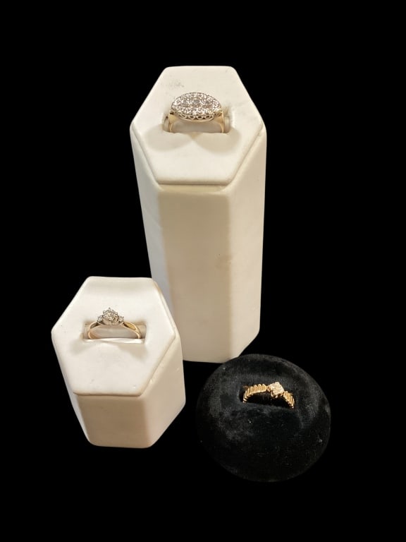Diamond Engagement Rings, Cluster Ring: 14 k yellow gold with round cut center stone, flanked with 2 smaller stones, size 5.5. 14 k yellow gold band with 4 diamonds setting, also 5.5. 14 k yellow gold cluster rings, 3 center stones. Size 5