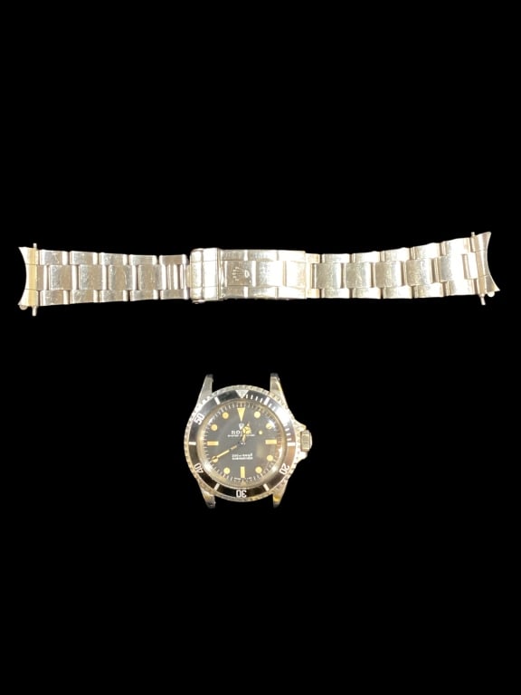 Rolex Submariner Fantasy Frankenstein: Rolex Submariner Meter First, Automatic movement, 200 m - 660 ft. Zinc Sulfied and Pumpkin patina. Created from assembled Rolex parts. Sold with Rolex flex link band