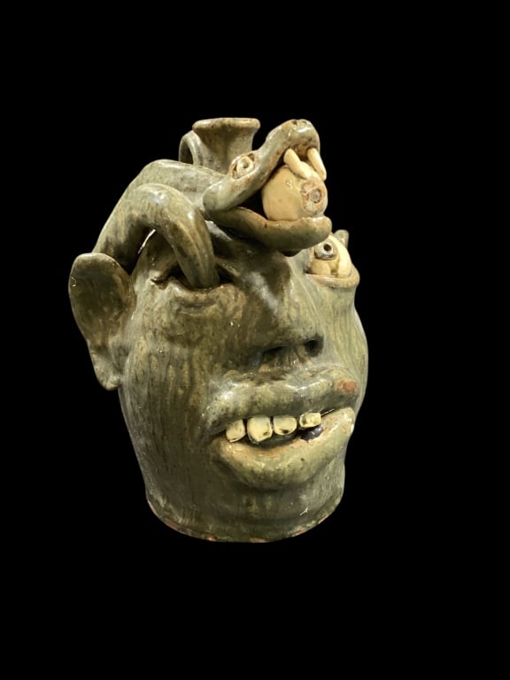 Southern Folk Art Snake Jug: My Bud..Snake Eye. Grotesque snake jug by WA Flowers. Big 10 inch jug, with snake coming from eye socket, with eye in his mouth.Runny green glaze, chip teeth, and pronounced handle. Signed on reverse 