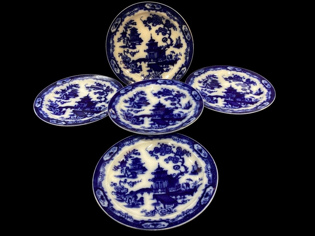 Flow Blue Plates: Set of 5 Dutch manufactured Plates, 10 inch diameter in the Hindostan pattern. Features a Chinoiserie design of architectural pieces.