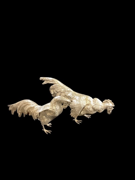 Pair Sterling Silver Gamecocks: Rare sterling Decorative Table accessories, each 12 inches in length. Highly detailed with large tail feathers. Stamped 925, and letters BHM. 22.32 ozt approximately