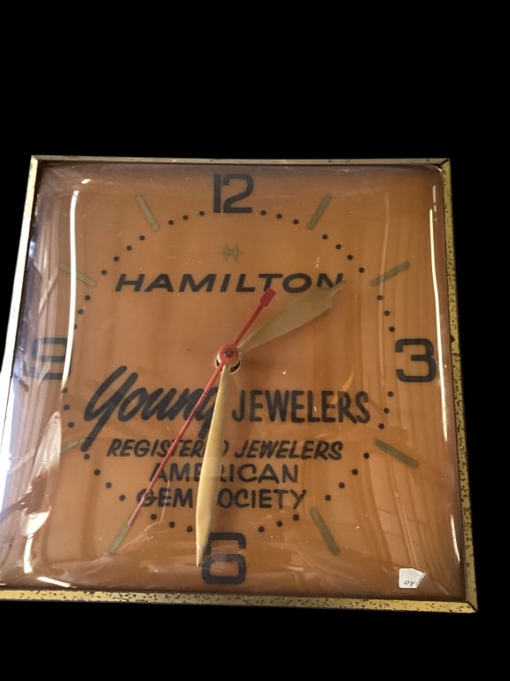 Hamilton Advertising Clock: Vintage Hamilton Watch Company light up Advertising clock for Young Jewelers, American Gem Society. Likely Pam clock Company. 13 x 13 inches in length square, metal framed with bubble glass
