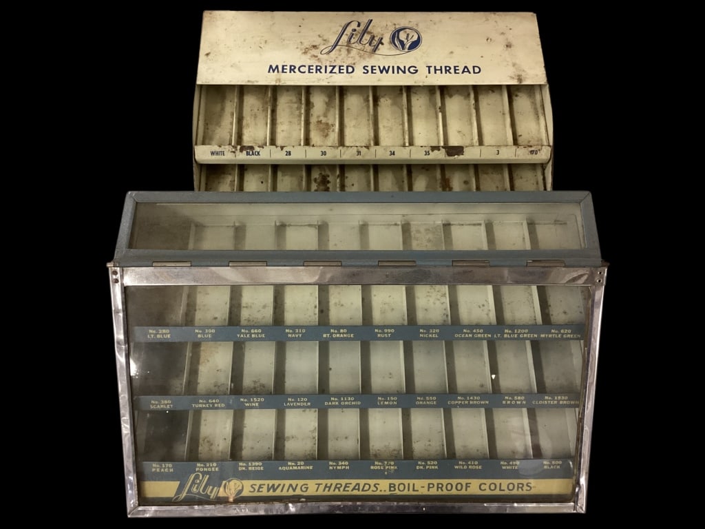 Two Lily Thread Display Spool Racks: Vintage metal display racks, one with lift front glass door, good blue graphics 30 count color display. Second rack in white with slant thread display, 30 count