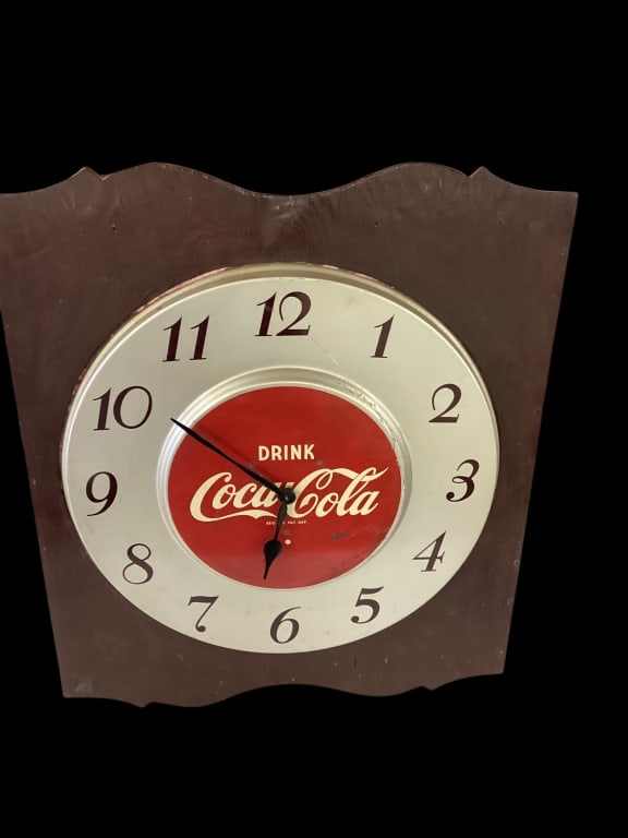 Vintage Electric Coca Cola Wall Clock: Large round 17 inch diameter Coca Cola Clock, classic logo in red on aluminum face with black numerals, mounted in outer wood frame total size 24 x 17 inches.