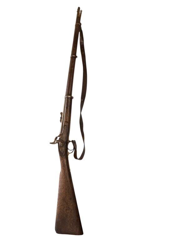 1853 Enfield rifle-musket: Full walnut stock, ram rod, leather sling, brass trigger guard stamped tower 1862 with Crown,