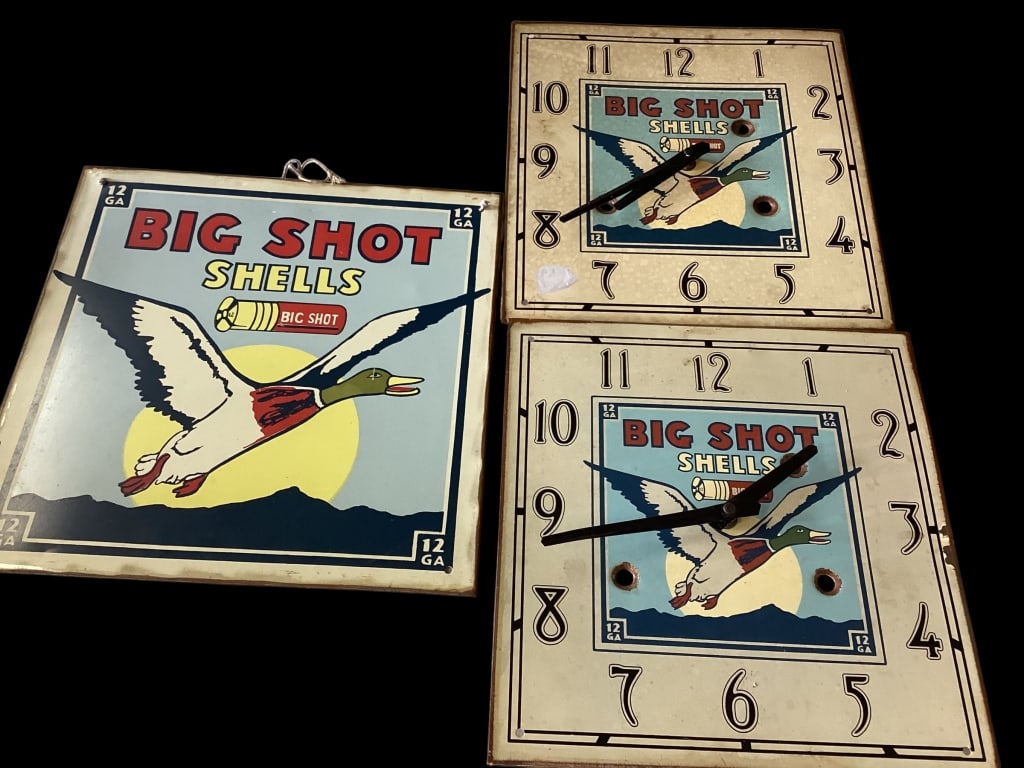 Big Shot Shells Sign and Clocks: Single sided side, 12 inch square with Big Shot Shells, two 10 inch square metal wall clocks, Duck logos with Big Shot Shells, and bullet holes