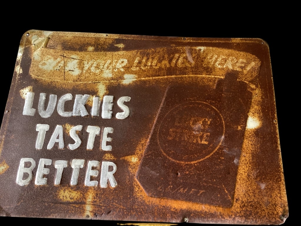 Three Tobacco Advertising Signs: Tin one sided signs, Model Smoking Tobacco, 23 x 12 inches , ( rough), Lucky Buy Them Here Cig pack sign ( faded), Luckies Taste Better - Buy Your Luckies Here ( rough