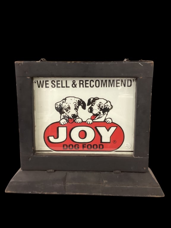 Wooden Counter Top Display Board: Heavy double sided glass and wood framed advertising display, allowing the store to vary the product display. Here showing a single sided paper sign for Joy Dog Food. Frame unlocks, with drop