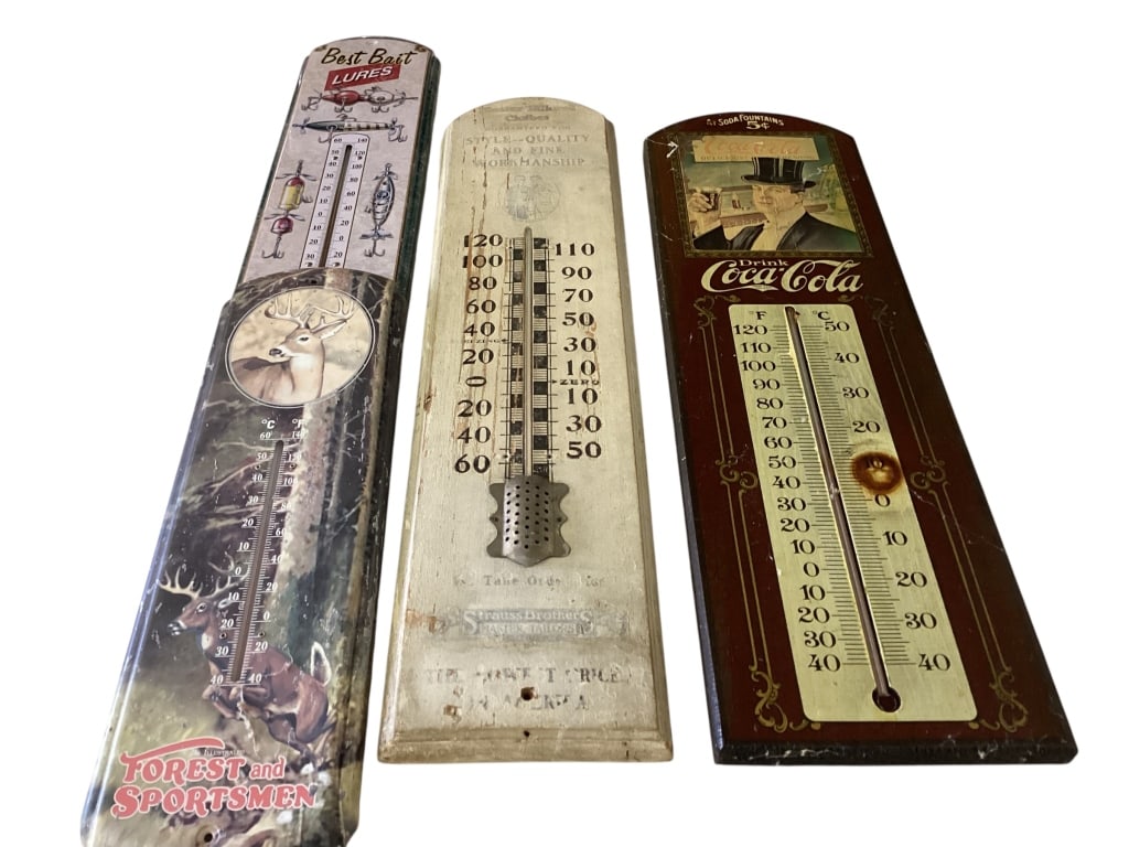 Four Advertising Thermometers: 23 inch Wooden thermometer Master Tailored Clothes, Strauss Brothers, painted wood w/ light lettering. Reproduction wooden Coca Cola thermometer 23 inches, tin Forest and Sportsman with deer, Tin