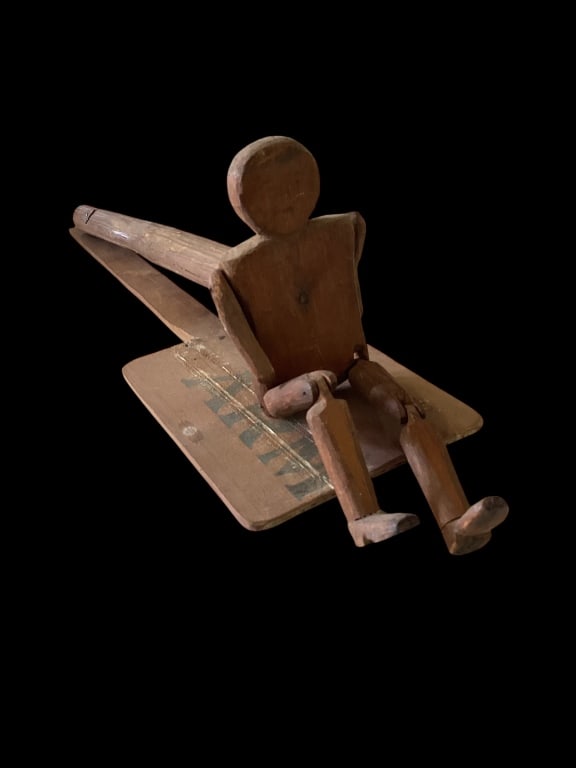 Folk Art Carved Jig Dancer: Jointed wooden jig dancer, with painted face, plywood slab jig board,