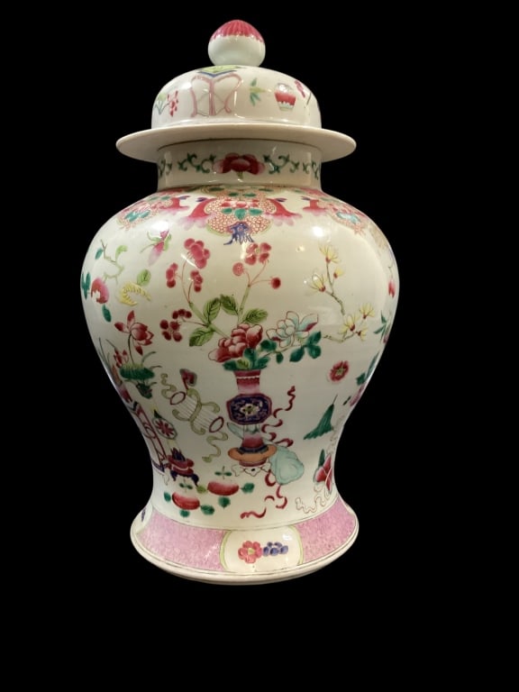 Chinese Porcelain Temple Jar: Famille Rose temple jar, baluster form at 14 inches. Vibrant hand painted polychrome figures and scenes, including birds, florals, fruit, kites, and clouds. Domed cover with reddish finial.