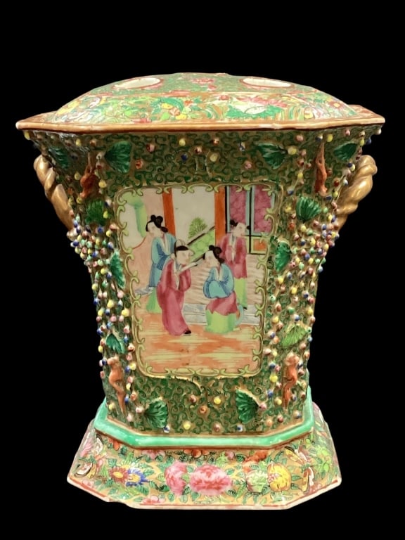 Chinese Porcelain Bough Pot: Famille Rose Porcelain featuring a squared shaped design with canted corners, heavily decorated with molded berries and vines. Hand painted panels depicting figures in garden settings, surrounded