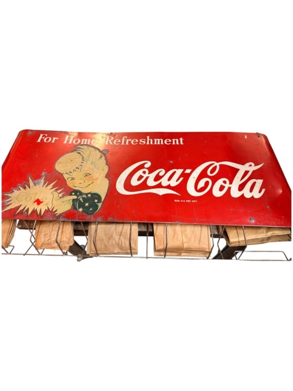 Rare Coca-cola Ad with Sack Dispenser ?Sprite Boy": Early 20th C mercantile coke ad, with rare with paper sack dispenser, graduated sizes, with iconic "Sprite Boy" 36 wide ex x 17 tall x 5.5 deep