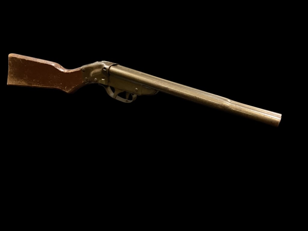 Vintage Daisy 1959 Cork Rifle: Double Barrel Daisy cork Popper Rifle, steel metal parts, bronzed gun stock. Break action cocks triggers, both barrels shoot corks. Dark wood stock.
