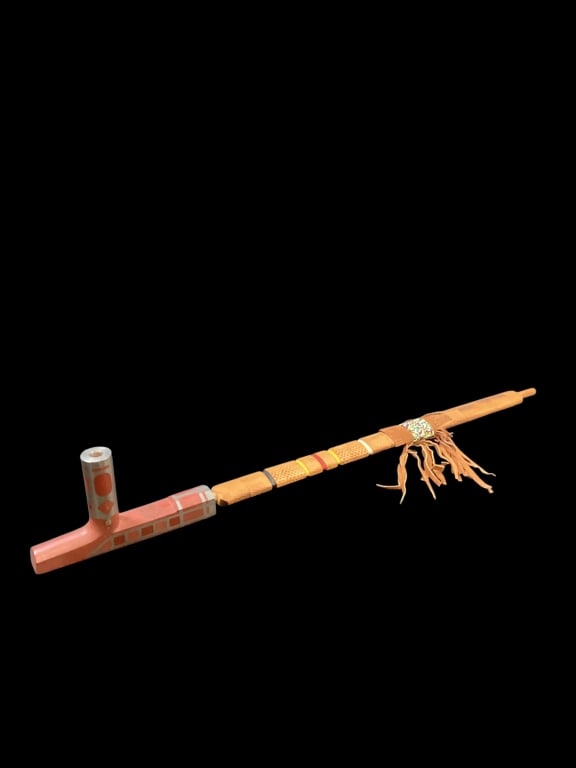 Native American Ceremonial Pipe: Large hand carved Caitlinite stone bowl, or pipe stem, banded in metal., with carved wood stem, leather and beadwork surround, paddle punched stem, banded colors of black, red, yellow.