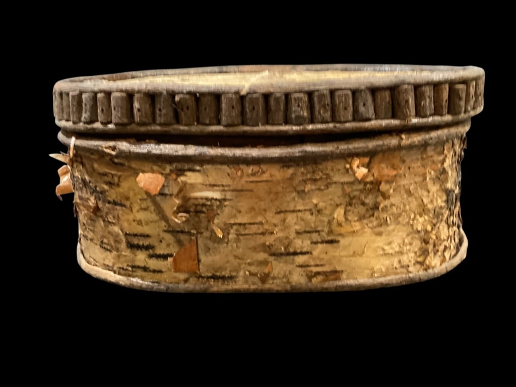 Birch Wood Pantry Box: Constructed of Birch bard and twig, 12 inch oval box with fitted lid, attributed to Ojibwa or Penobscot makers. A necessity box for storing spices, or dried herbs, or sewing notions
