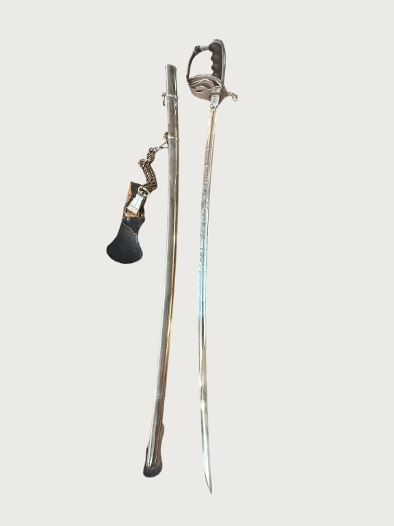 1955 Virginia Polytechnic Institute (VPI) Sword: This is a personalized Virginia Polytechnic Institute (VPI) cadet sword, dated 1955 on the blade. The blade is high-polish stainless steel and features intricate etching, including the school