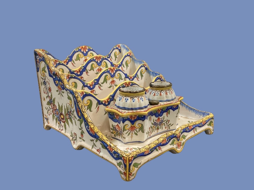 French Faience Desk Stand: Quimper or Rouen style decorated double inkwell with intergrated letter rack. 6 x 8 x 8.5 inches. Decorated in vibrant folk colors of blue, yellow and red on white body.