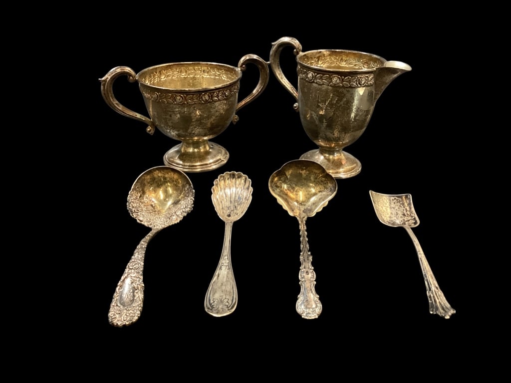 Sterling Articles: Sterling cream and sugar set, pattern is Royal Rose, 4 Sterling flatware serving pieces. 5.5 inch Repousse ladle, shell form sugar spoon, English silver sugar spoon, Sauce ladle. 10.21 0zt