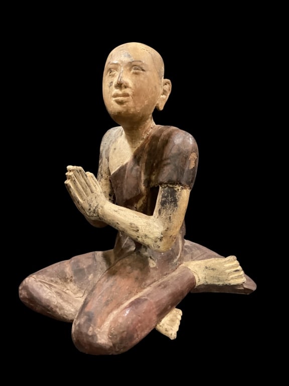 Seated Figure of Lohan: Likely Burmese, depicts a kneeling figure in gesture of prayer and respect. 16 inches tall with carved wood with painted details. - ()